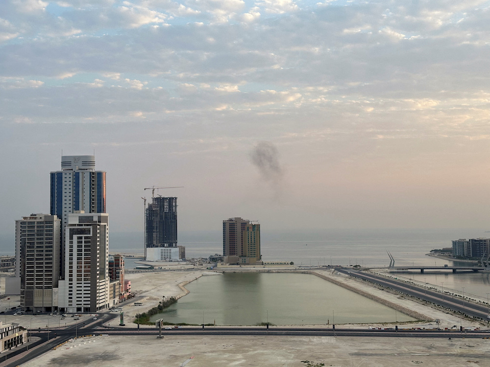 Smoke rises after a drone was intercepted during early morning hours in Manama, Bahrain, July 14, 2026. (Reuters)