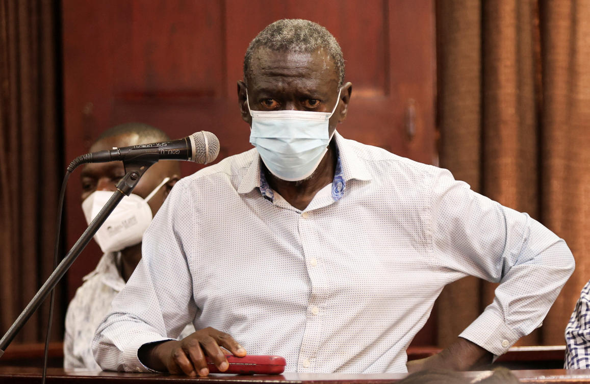Uganda’s four-time presidential candidate Kizza Besigye wears a facemark standing in the dock as he is charged with treason alongside his colleague Obeid Lutale, at the High Court in Kampala, Jul. 13, 2026. (Reuters)