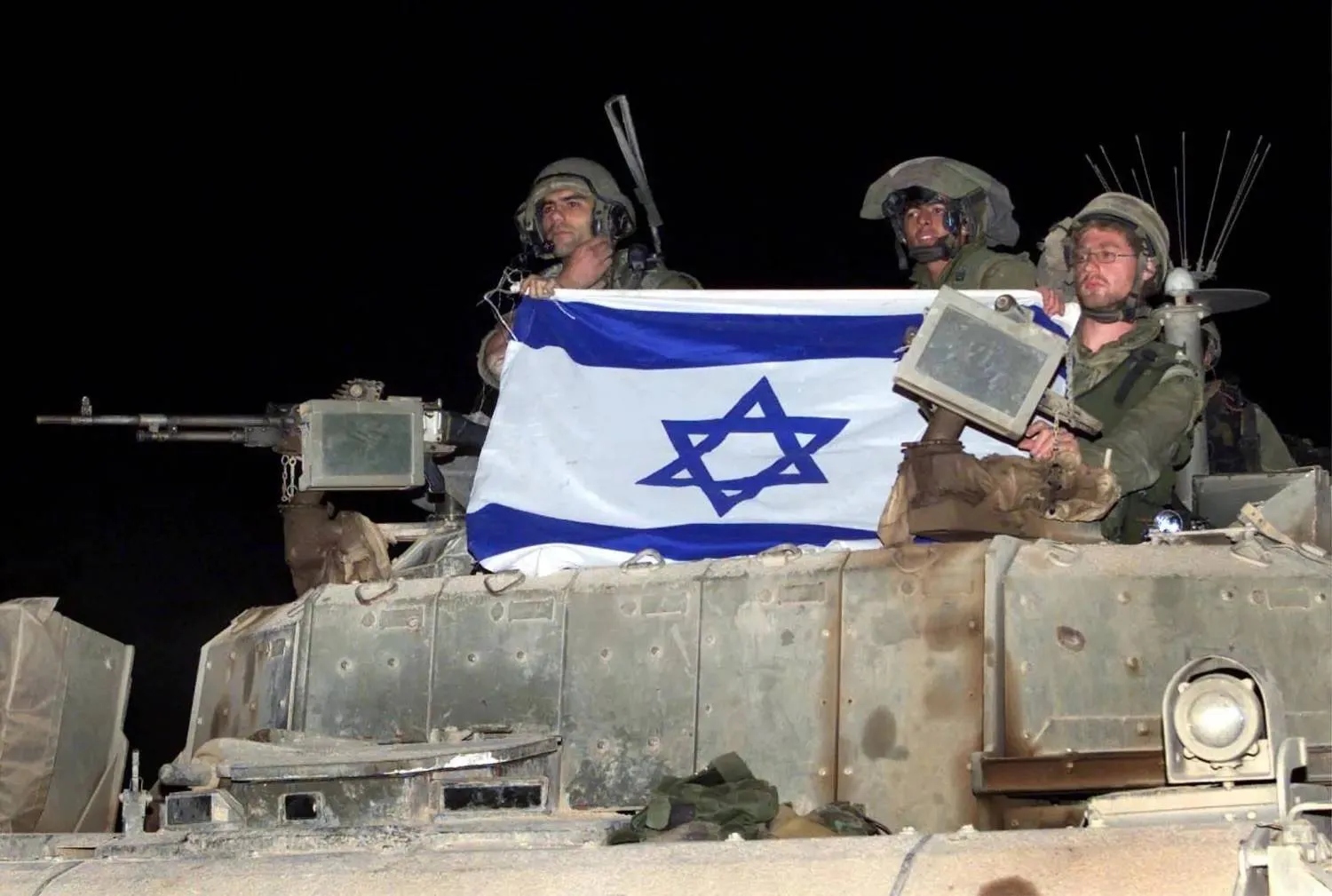 Israeli soldiers aboard an armored vehicle along the Lebanon border (FILE/Reuters)