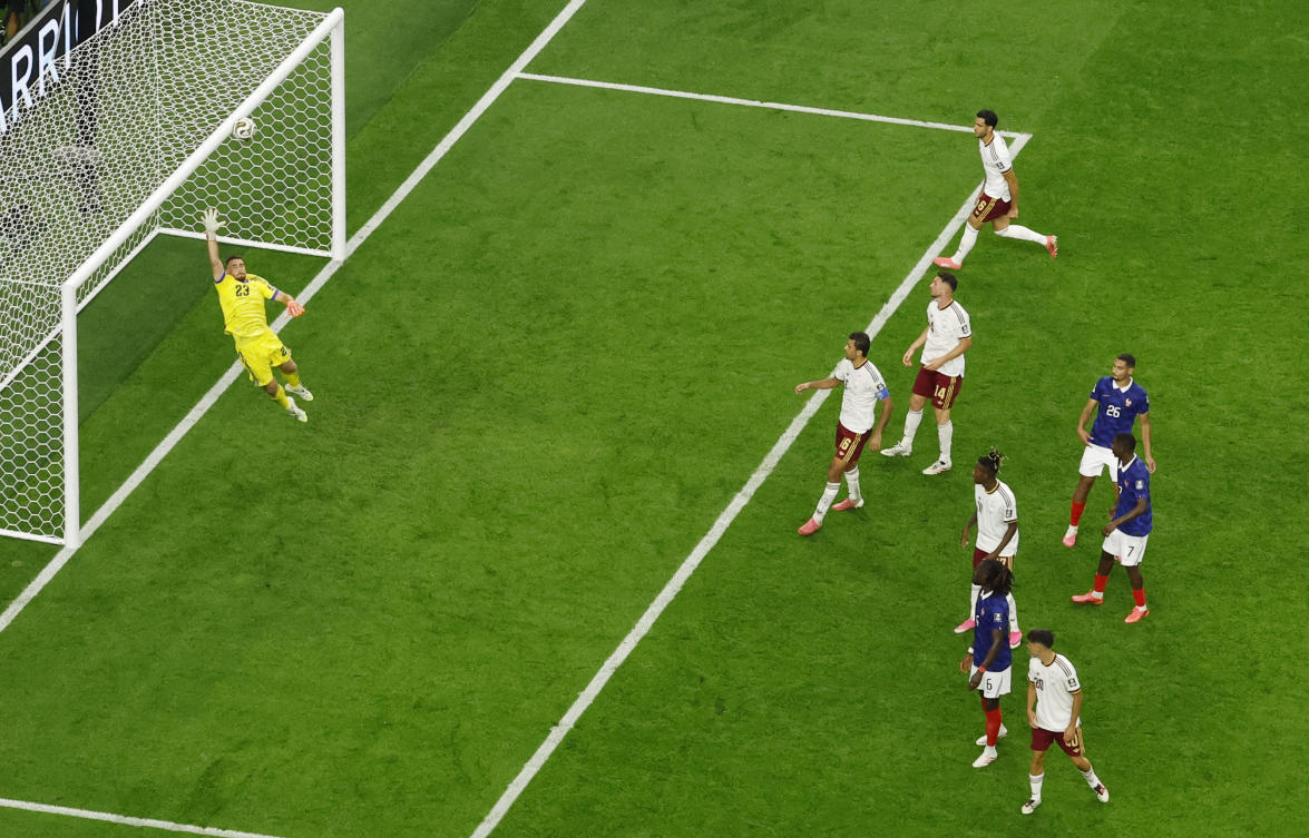 Spain’s Unai Simon dives as France’s Kylian Mbappe shoots at goal from a free kick during their — FIFA World Cup 2026 — Semi Final — match — Dallas Stadium, Arlington, Jul. 14, 2026. (Reuters)