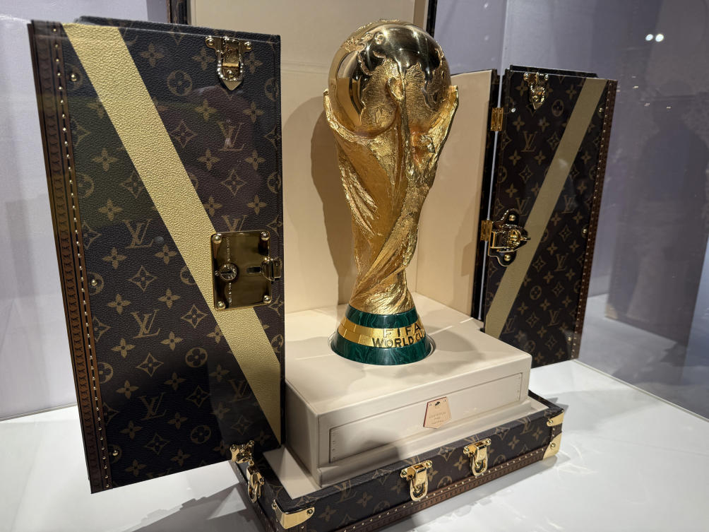 General view as a World Cup replica trophy is displayed in a Louis Vuitton trophy trunk in a Louis Vuitton store in New York City — Jul. 16, 2026. (Reuters)