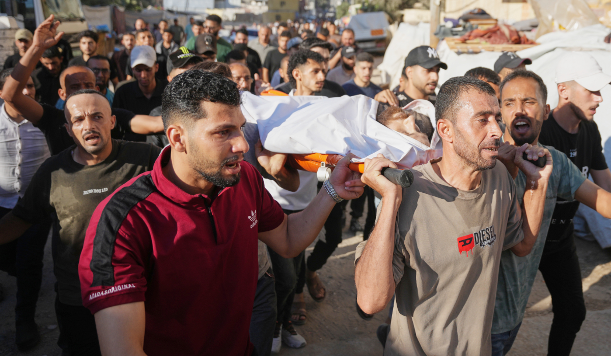Mourners carry the body of a Palestinian man who was killed following an Israeli airstrike, during his funeral in Nuseirat, central Gaza Strip, Friday, July 17, 2026. (AP)