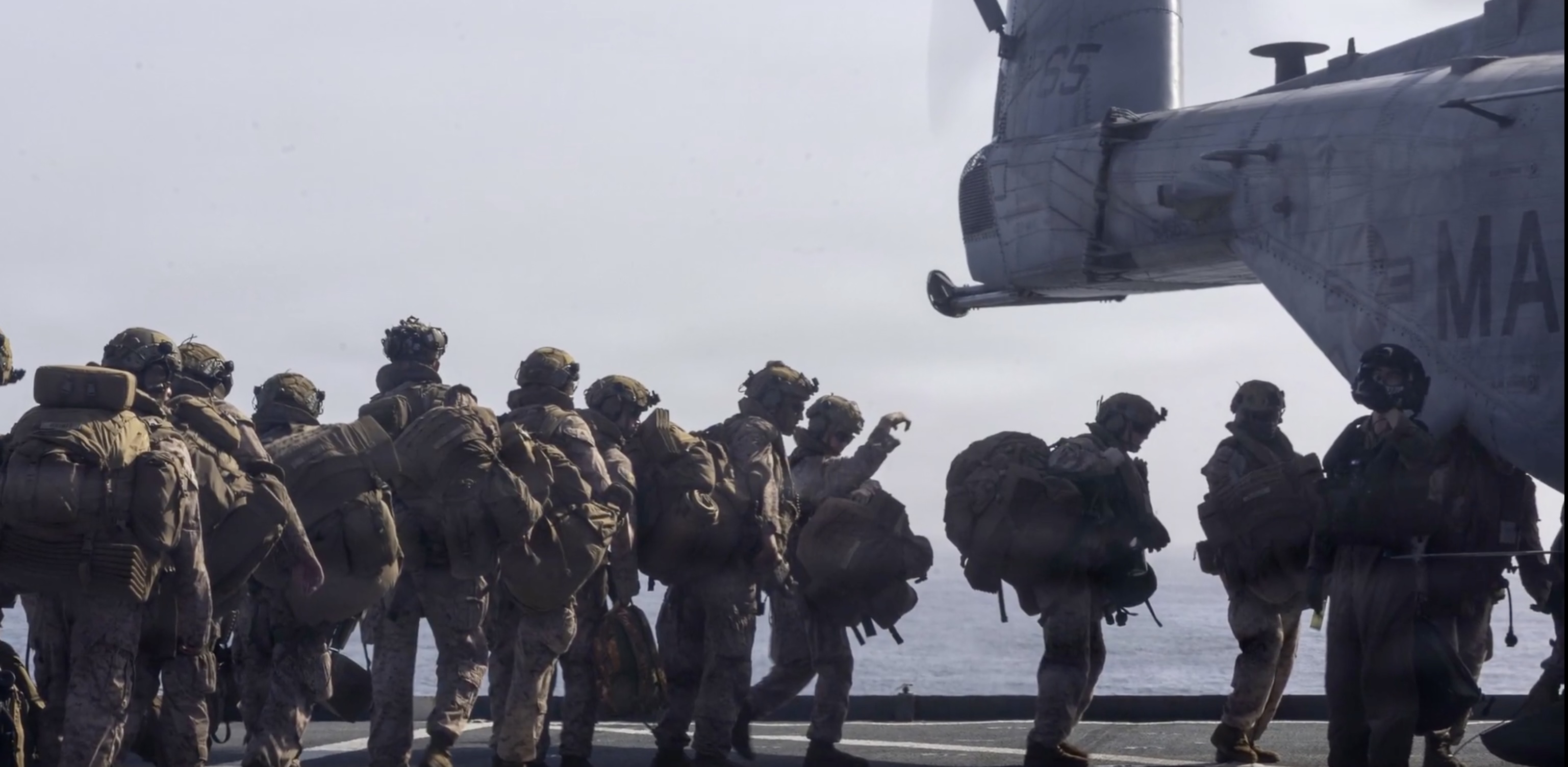 This photo from a video posted by the US military on social media on July 18, 2026, shows American troops boarding a helicopter on a warship in the Arabian Sea. The US military said 16 service members have been killed and over 430 wounded so far since the war with Iran began on February 28. (X: @CENTCOM video)