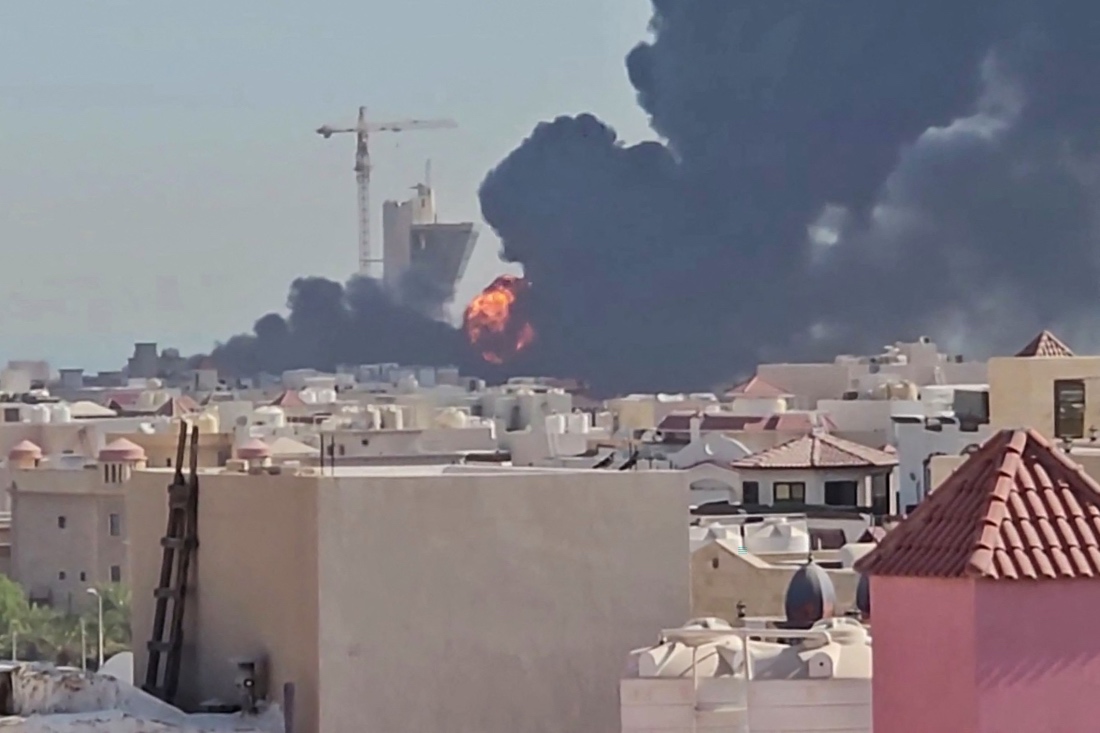 This screen grab taken from UGC video footage posted on social media on July 18, 2026, shows a plume of black smoke and flames billowing over the town of Mangaf, south of Kuwait City. (AFP)
