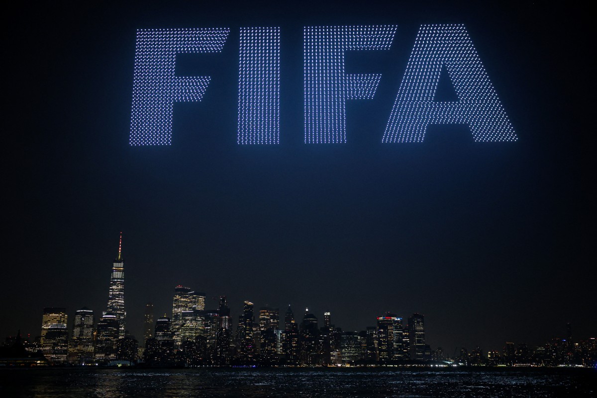 A general view as a drone show takes place over the New York Harbour, displaying FIFA logo, in front of the Lower Manhatten skyline at Liberty State Park on July 17, 2026 in Jersey City, New Jersey. (AFP)