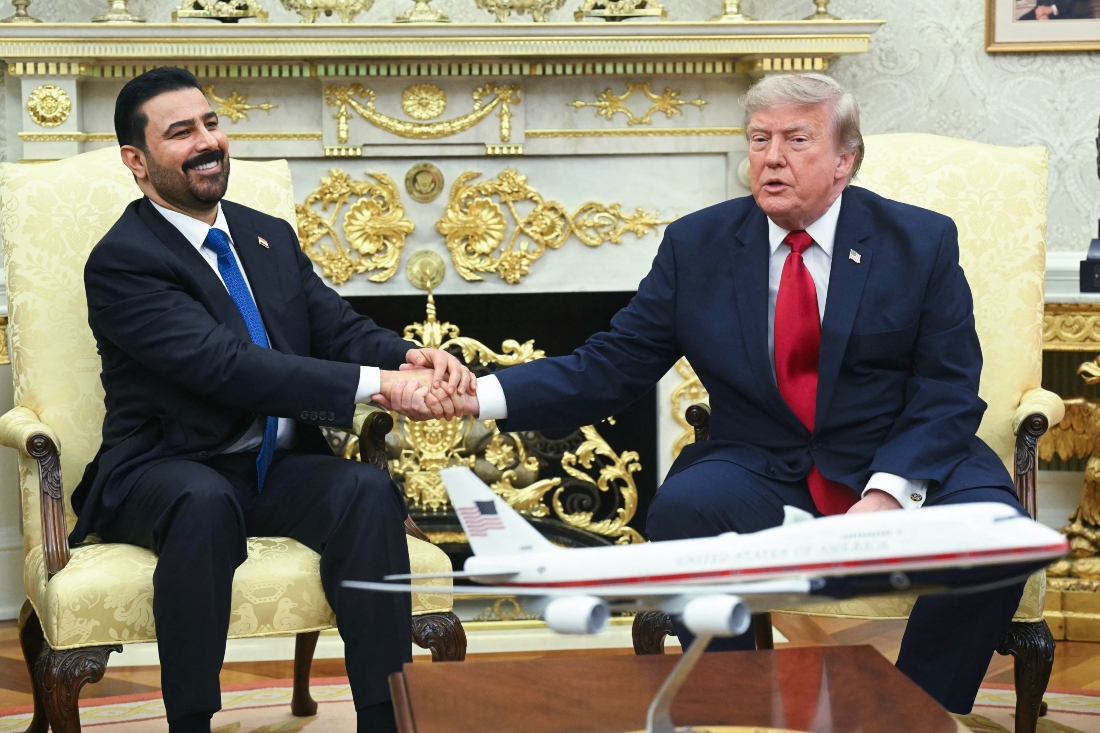 US President Donald Trump shakes hands with Prime Minister of Iraq Ali al-Zaidi (L) in the Oval Office of the White House in Washington, DC. (AFP)