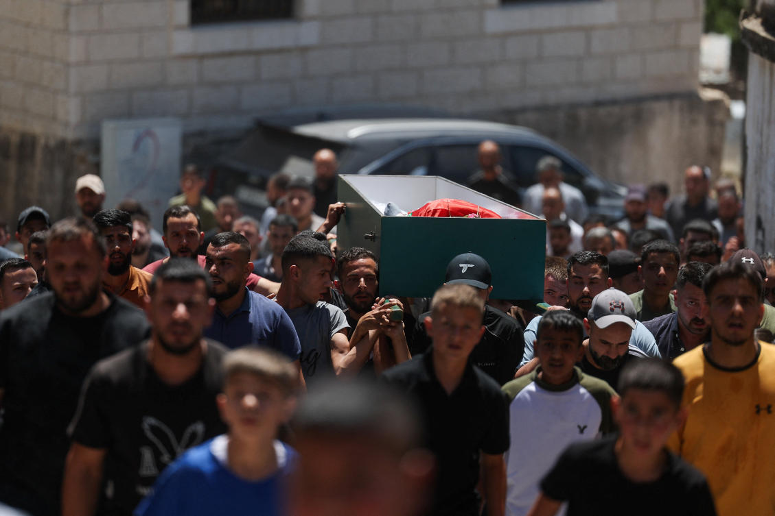 Palestinians hold a funeral procession for two men killed during an Israeli raid on their village, Deir Jarir, in the Israeli-occupied West Bank, July 20, 2026. (REUTERS)