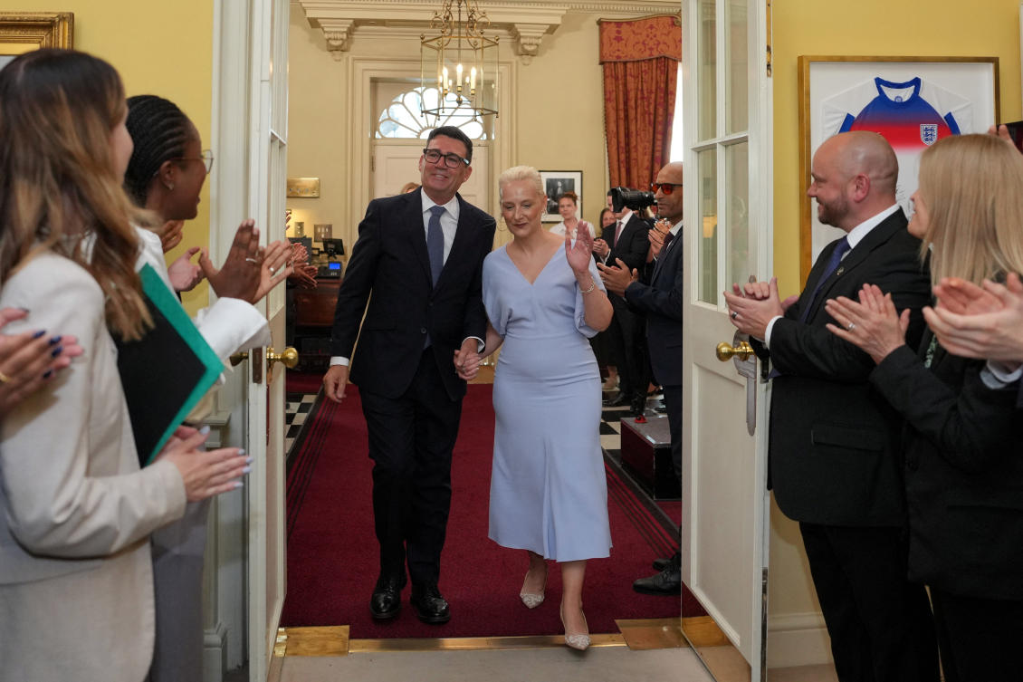 Staff clap as Britain’s newly appointed Prime Minister Andy Burnham and his wife Marie-France van Heel walk into 10 Downing Street in London, Britain, July 20, 2026. (Reuters)