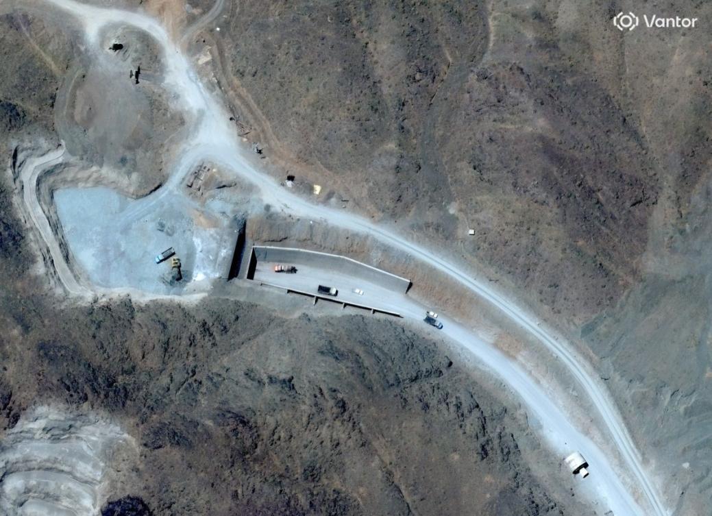This handout satellite image courtesy of Vantor shows vehicles at the western entrance of the Pickaxe Mountain tunnel complex adjacent to the Natanz Nuclear Facility near Natanz, Isfahan province, central Iran, on June 21, 2026. (Vantor/AFP)