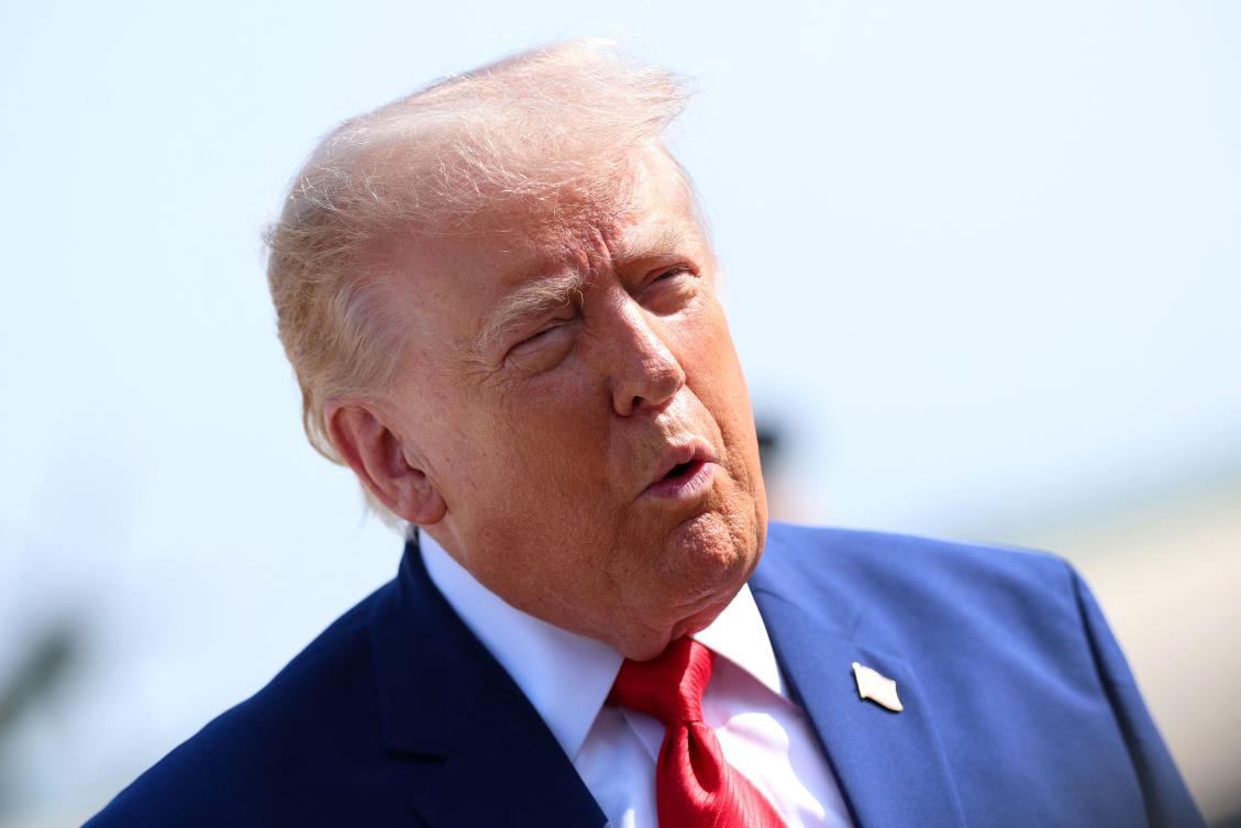 US President Donald Trump stops to speak to reporters before boarding Air Force One en route to Dover Air Force Base on July 22, 2026 at Joint Base Andrews, Maryland. (AFP)