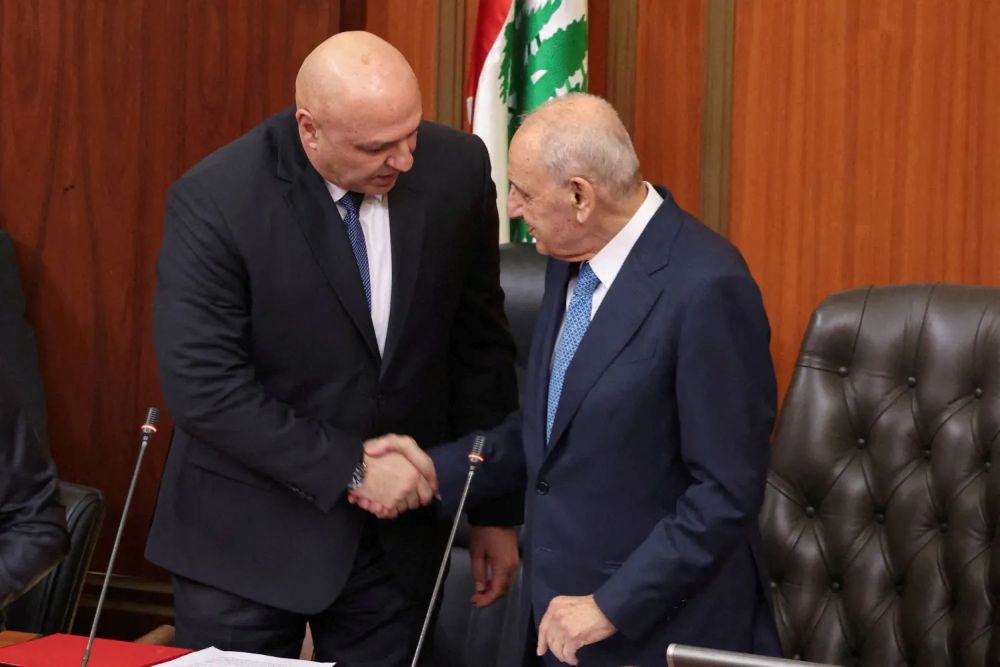 Lebanese Parliament Speaker Nabih Berri shakes hands with Lebanon’s army chief Joseph Aoun after he is elected president, at the parliament building, in Beirut, Lebanon, Jan. 9, 2025. (Reuters)