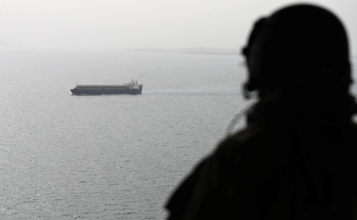 Above, a ship crosses through the strategic strait of Bab El-Mandeb as seen from aboard a military aircraft. (AFP file photo)