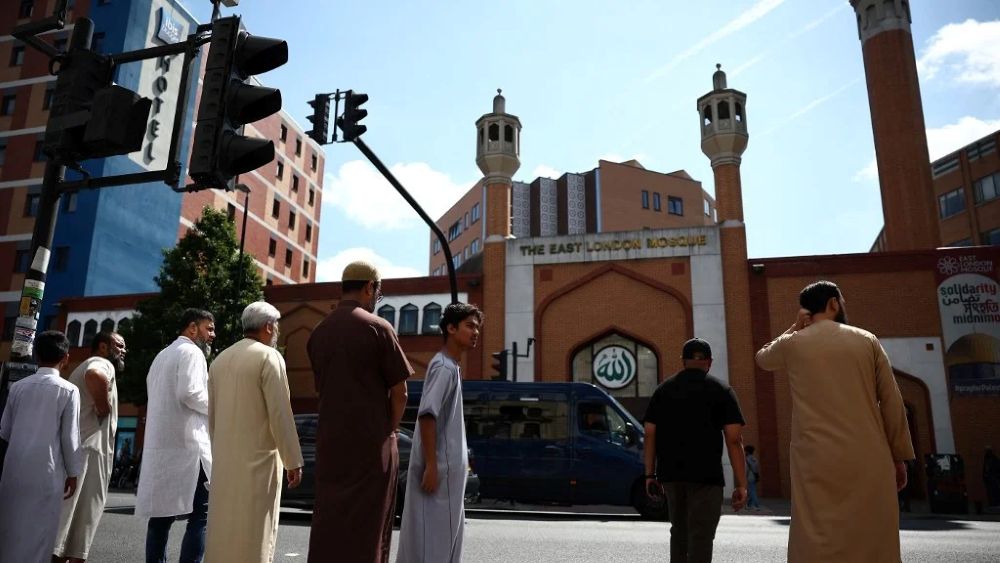 People stand outside the East London Mosque in Tower Hamlets, London, England, Aug. 9, 2024. (AFP)