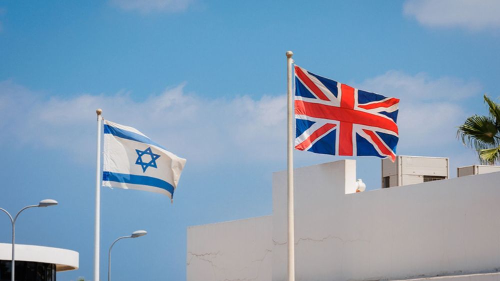 Union Jack and Israeli flag seen on Kikar Plumer street in Tel Aviv. (iStock, AllyE)
