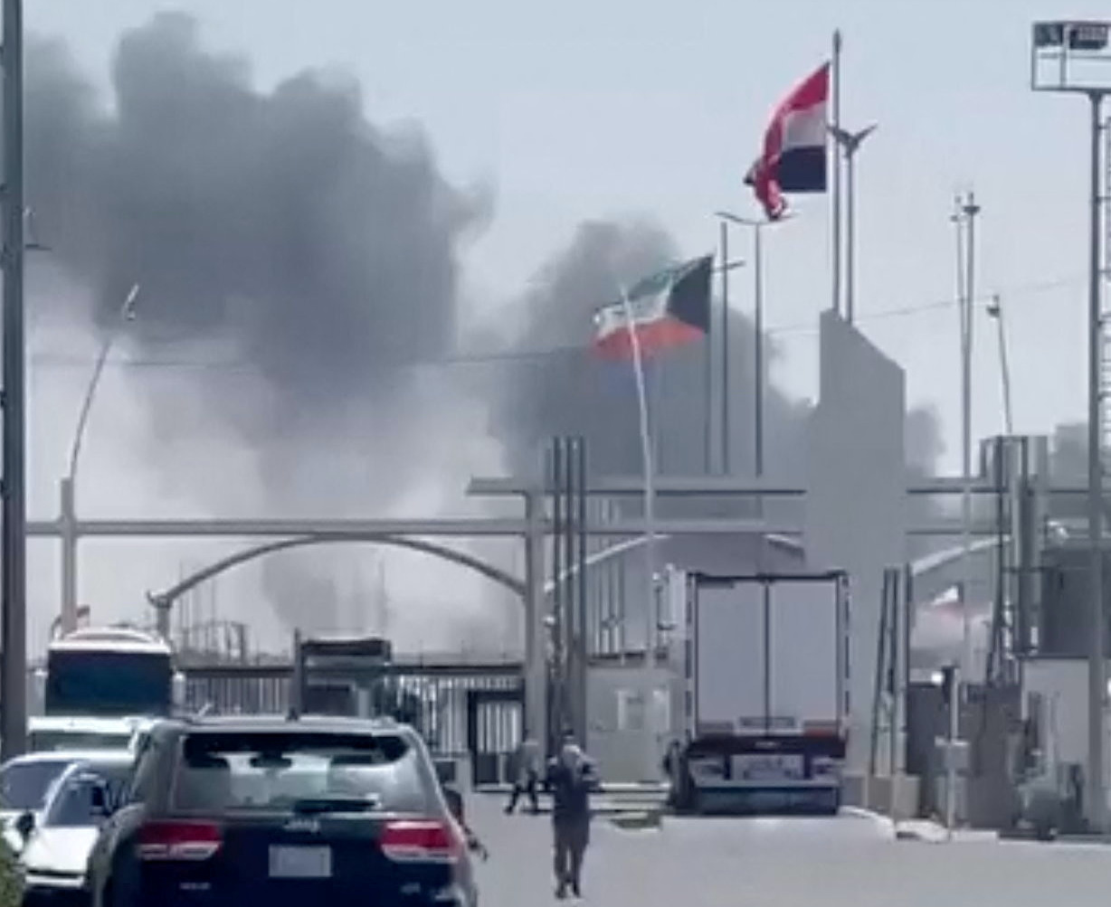 Smoke rises at the Abdali border crossing with Iraq, after a drone attack on Thursday. (Social media via Reuters)