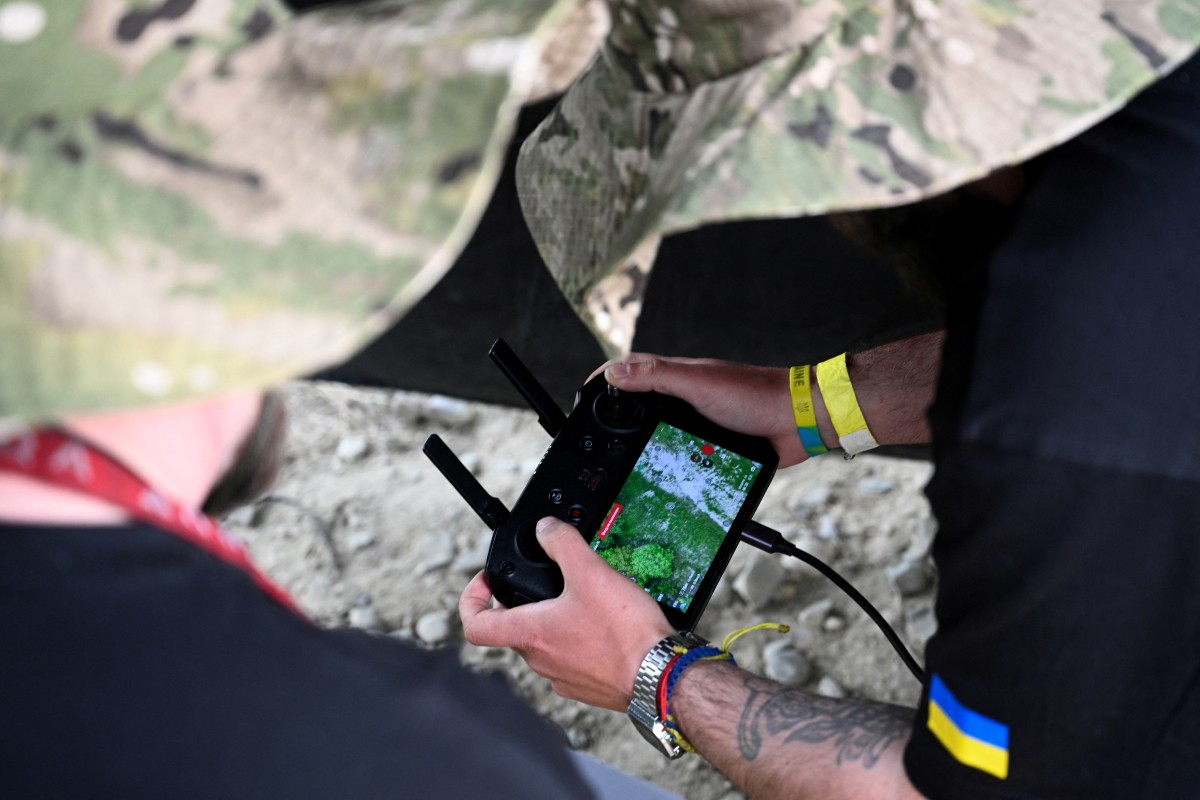 A Ukrainian serviceman pilots a drone during the “Wild Drones” racing competition, designed to simulate battlefield conditions, in Truskavets, Lviv region. (AFP)