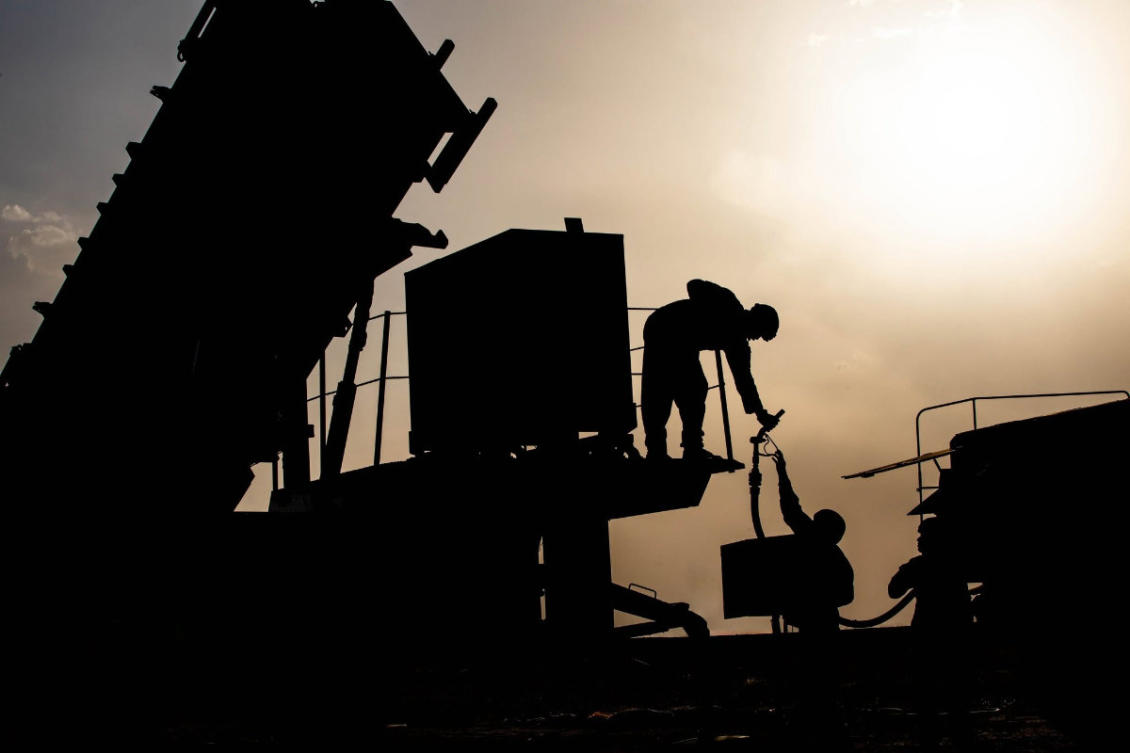 US Army soldiers work to refuel a generator at a base in the Middle East. (X: CENTCOM)