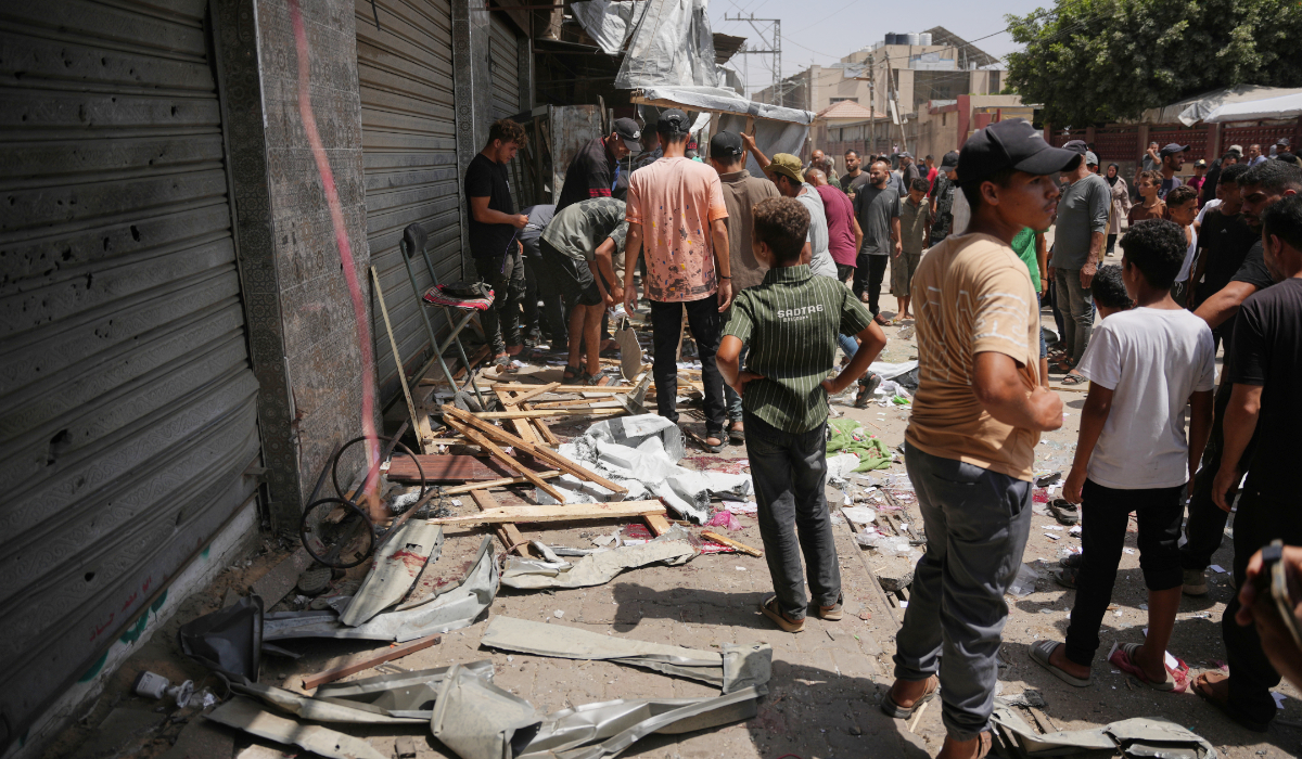 Palestinians inspect the site of an Israeli military strike, in Deir al-Balah, central Gaza Strip, Saturday, July 25, 2026. (AP)
