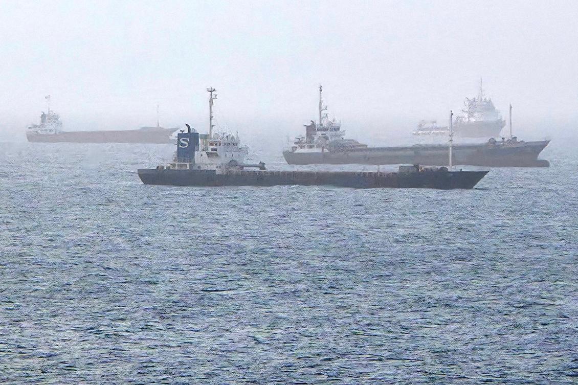 Above, vessels transiting through the Gulf of Oman near the the Strait of Hormuz on July 25, 2026. Iran has effectively blockaded the strait since the start of the Middle East war in late February. (AFP)