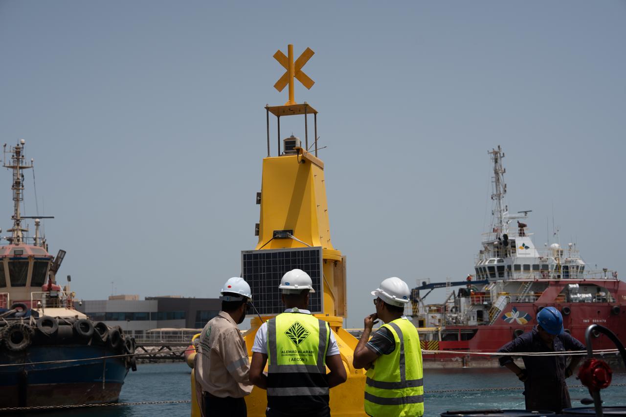 Technical teams prepare to deploy a smart monitoring buoy at King Fahd Industrial Port in Jubail. (Supplied)