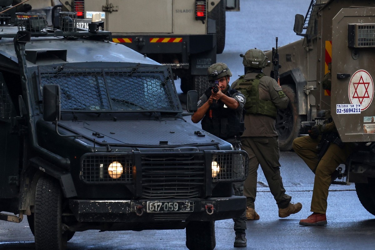 Israeli army vehicles block a road during a raid in Nablus, in the Israeli-occupied West Bank on July 26, 2026. (AFP photo)