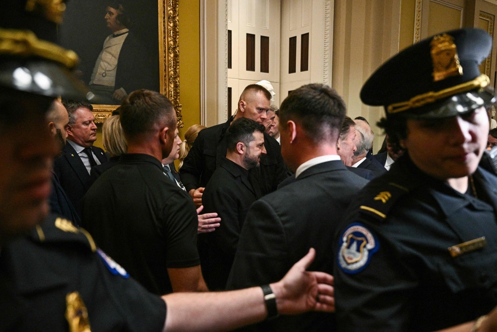 Ukrainian President Volodymyr Zelensky is greeted after a meeting with US senators at the US Capitol in Washington, DC. (AFP)
