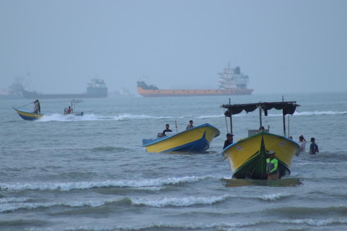 Above, shipping vessels in the Strait of Hormuz near the beach of Bandar Abbas, Iran on July 27, 2026. (ISNA via WANA/Reuters)