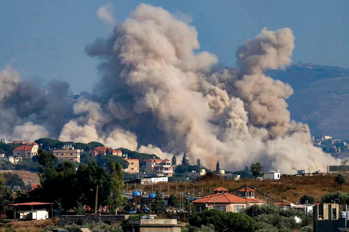 Smoke rises following an Israeli controlled-explosion on the village of Kfartibnit as seen from Nabatieh in southern Lebanon on Wednesday. (AFP)