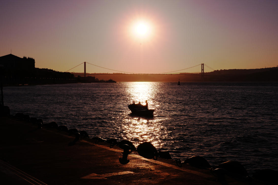 A fisherman works as the sun rises over the Bosphorus on a summer day in Istanbul, Turkiye. (File/AP)