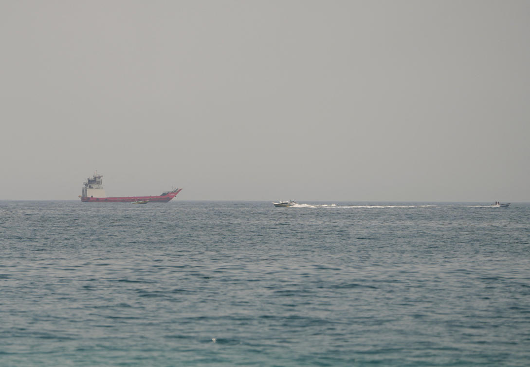 The Al-Areesh, a QatarEnergy-controlled liquefied natural gas tanker, exited the Strait of Hormuz overnight. Above, vessels at the Strait of Hormuz, as seen from Musandam, Oman, on July 29, 2026. (Reuters file photo)