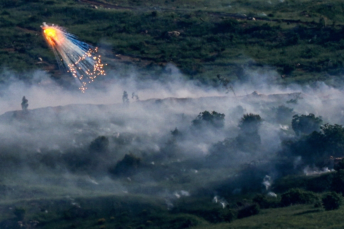 An explosion of what appears to be white phosphorus fired by the Israeli military on the Lebanese side of the border. (FILE/REUTERS)