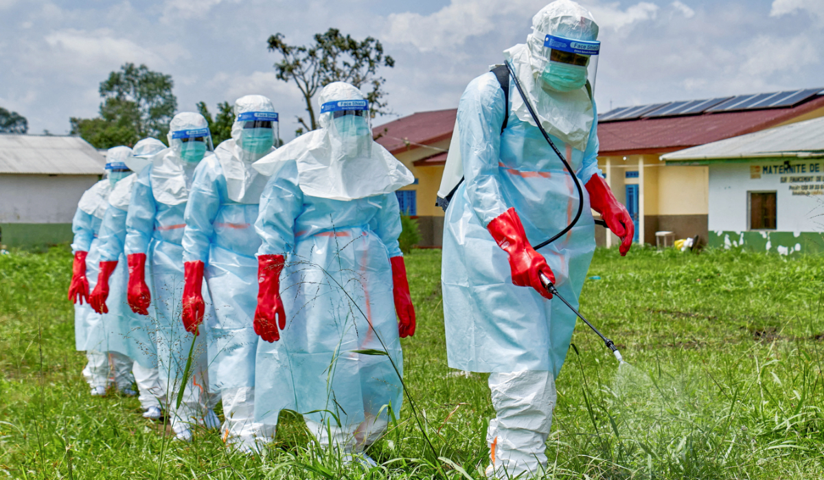 Red Cross workers walk in a formation as they disinfect Rwampara general hospital before handling the body of a person who died of Ebola, as aid agencies intensify efforts to contain a new Ebola outbreak involving the Bundibugyo strain, in Rwampara outside Bunia, Ituri province, Democratic Republic of Congo, May 21, 2026. (REUTERS)
