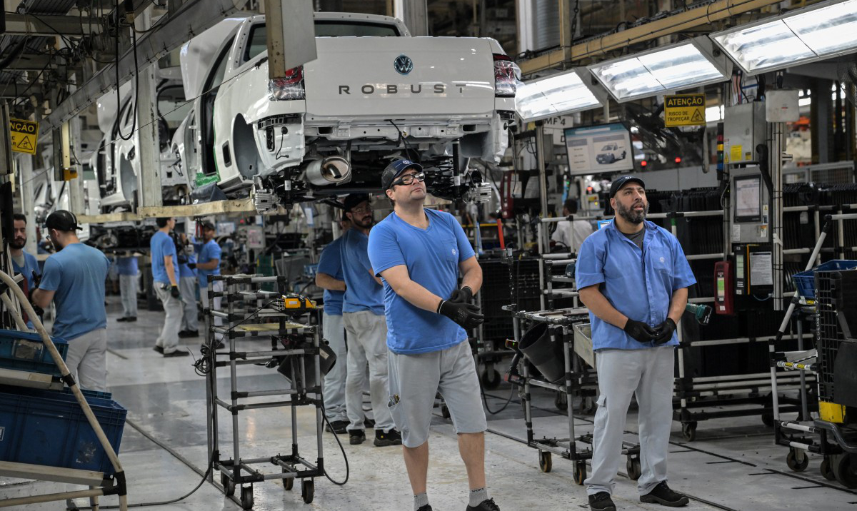 Volkswagen employees work on an assembly line at the company's plant in Brazil. (AFP)