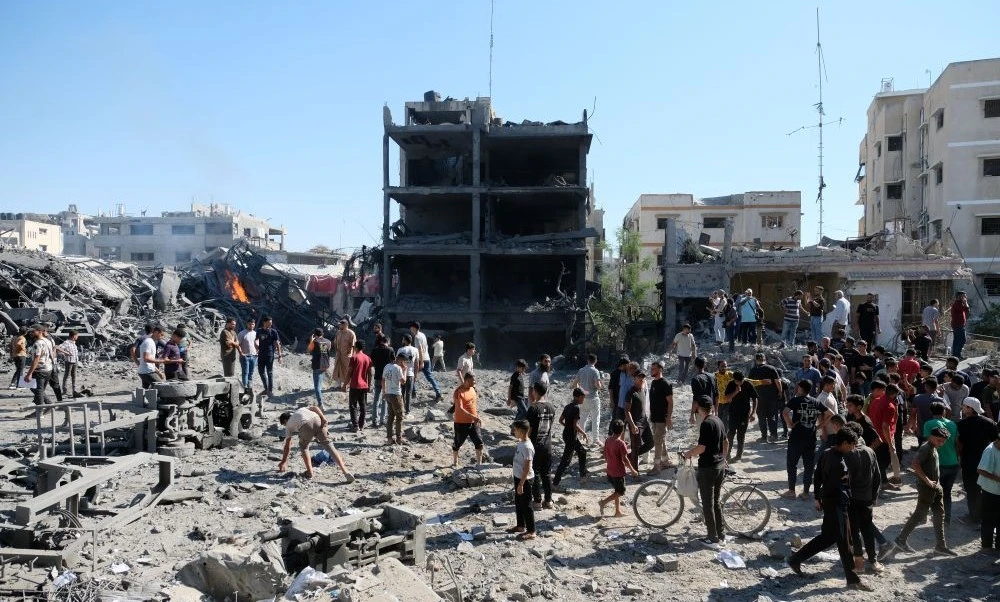 Palestinians gather around the site of an Israeli military drone strike on a blacksmith shop in Gaza, July 12, 2026. (AP Photo)