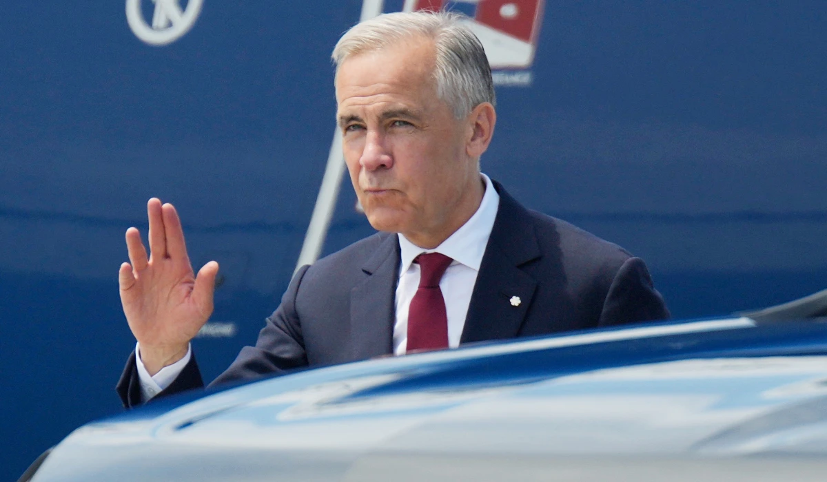 Canada Prime Minister Mark Carney waves as he arrives to board a government plane in Ottawa, Monday, July 6, 2026. (AP)