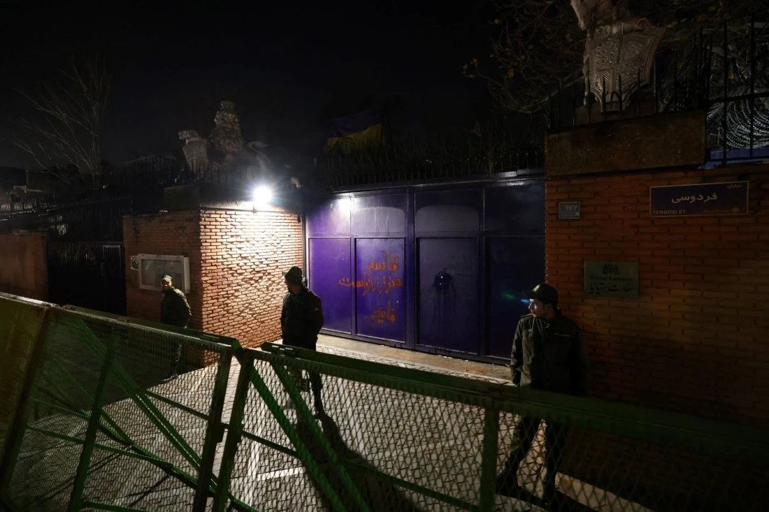Security staff stand guard in front of the British embassy during a demonstration in solidarity with the Palestinian people in Tehran, Iran. (AFP)