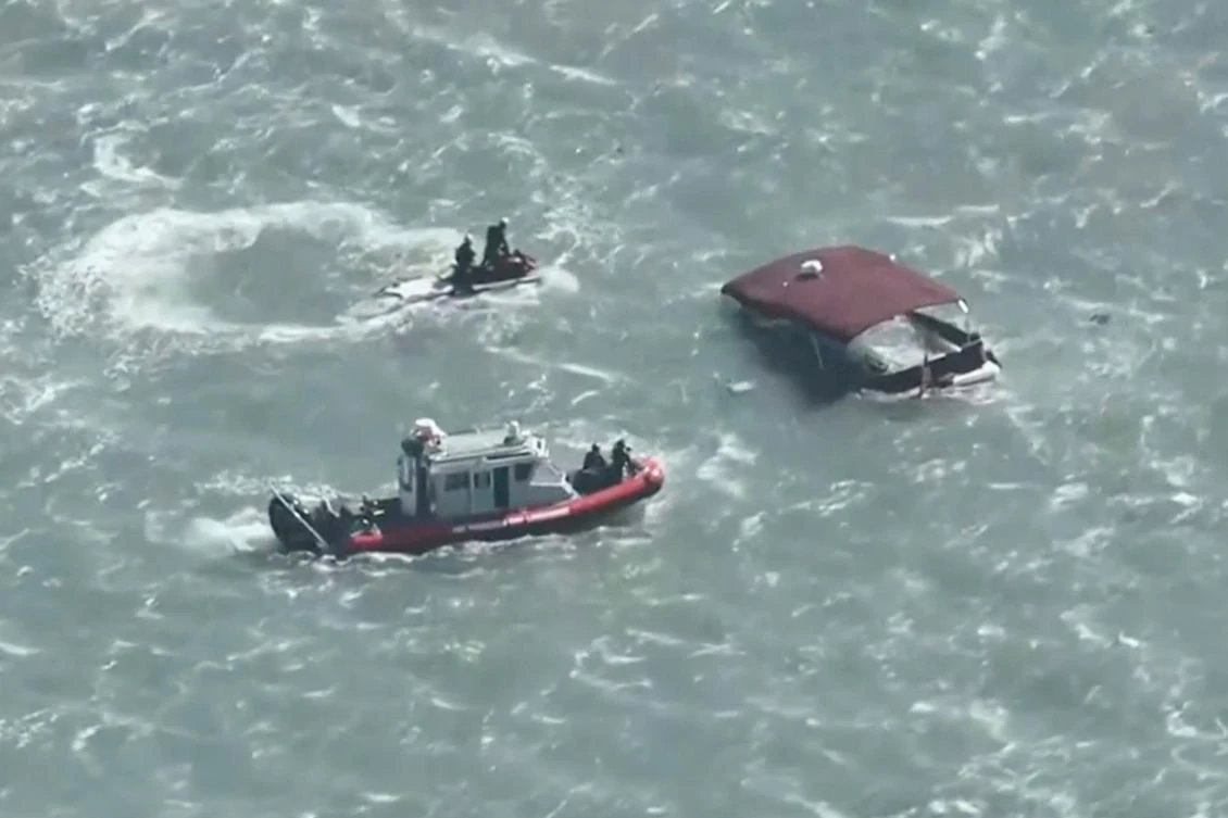 This image made from video provided by KGO-TV shows first responders reacting to a sinking boat on July 14, 2026, in the waters off of San Francisco. (KGO via AP)
