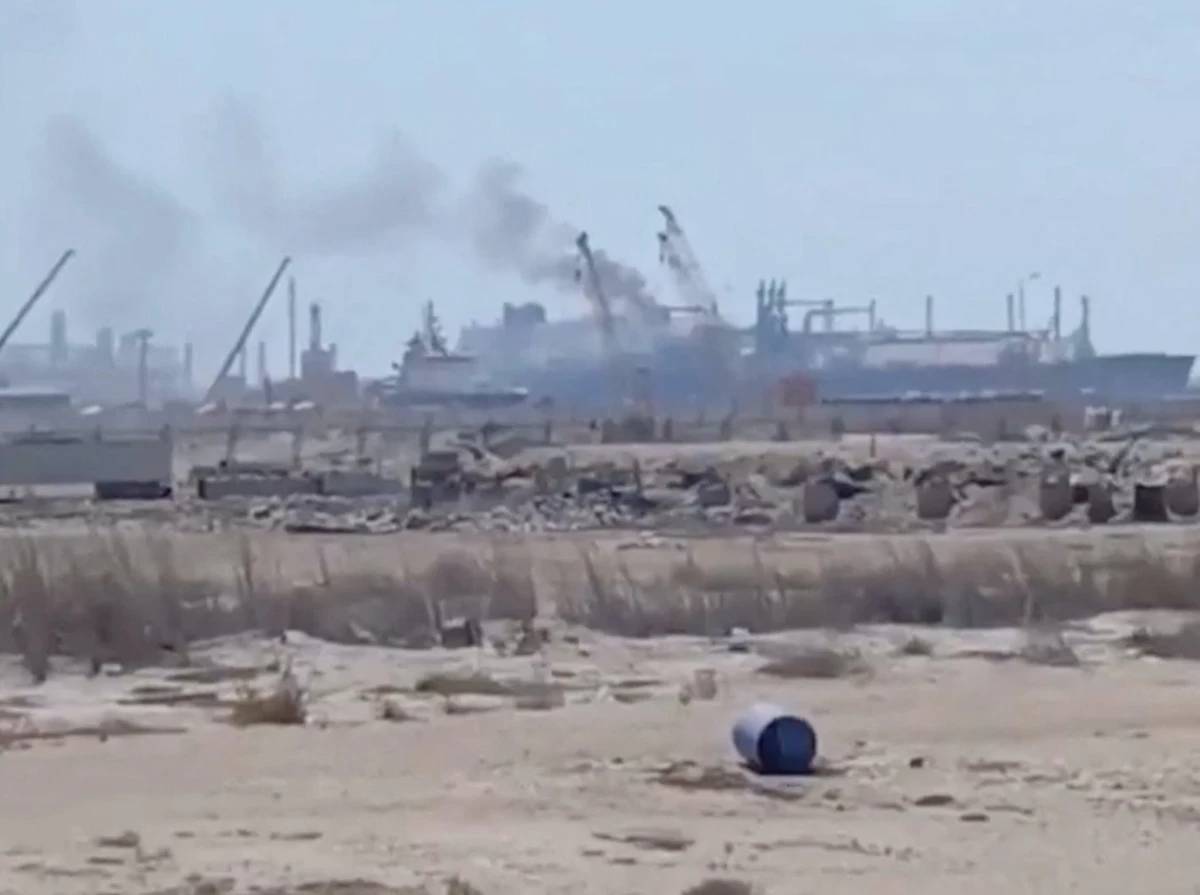 Smoke rises from a gas tanker after a drone strike, maritime security firm Ambrey said, at Damietta port, Egypt on Wednesday. (Social media/via Reuters)