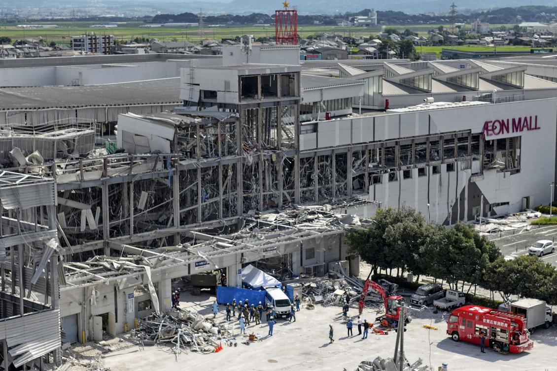In this aerial image taken with a drone, responders work outside AEON Mall Kumamoto after an explosion occurred following an earthquake, in Kashima, Kumamoto Prefecture, southern Japan, , Jul 30, 2026. (AP)