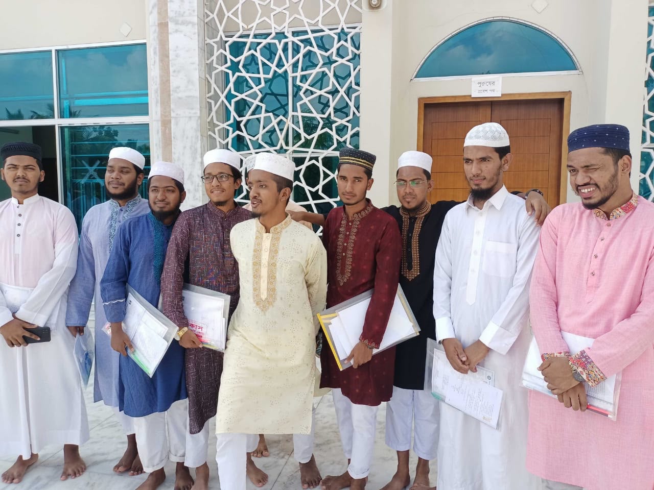 Alimul Islam, second right, and fellow students take part in a graduation ceremony at their boarding school in Khulna, Bangladesh, in 2023. (Alimul Islam)