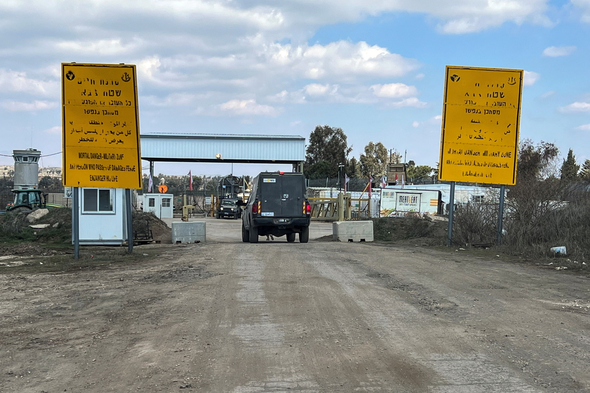 An Israeli military vehicle drives by the fence of the ceasefire line by Syria and the Israeli-occupied Golan Heights, at Quneitra crossing in the Golan Heights March 2, 2025. (Reuters)