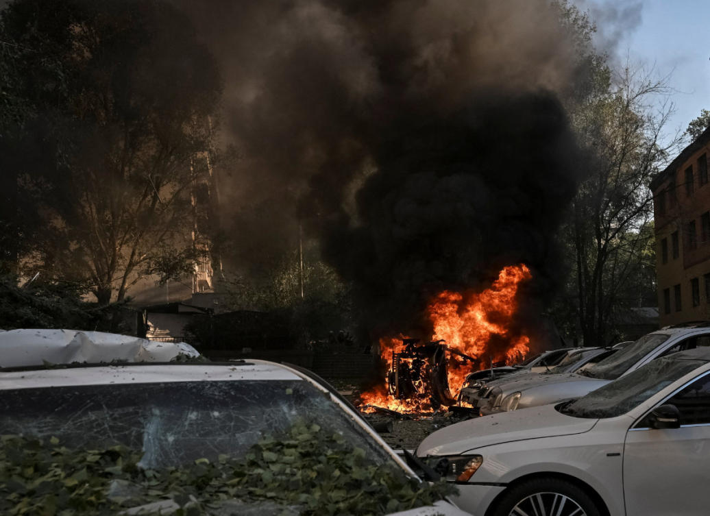 Cars burn near apartment buildings at a site of a Russian air strike, amid Russia's attack on Ukraine, in Zaporizhzhia, Ukraine, on August 2, 2026. (Reuters)