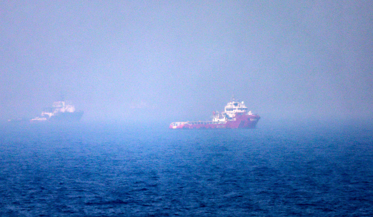 This picture shows ships sailing near the Strait of Hormuz off the eastern coast of the United Arab Emirates at Khor Fakkan on July 13, 2026. (AFP)