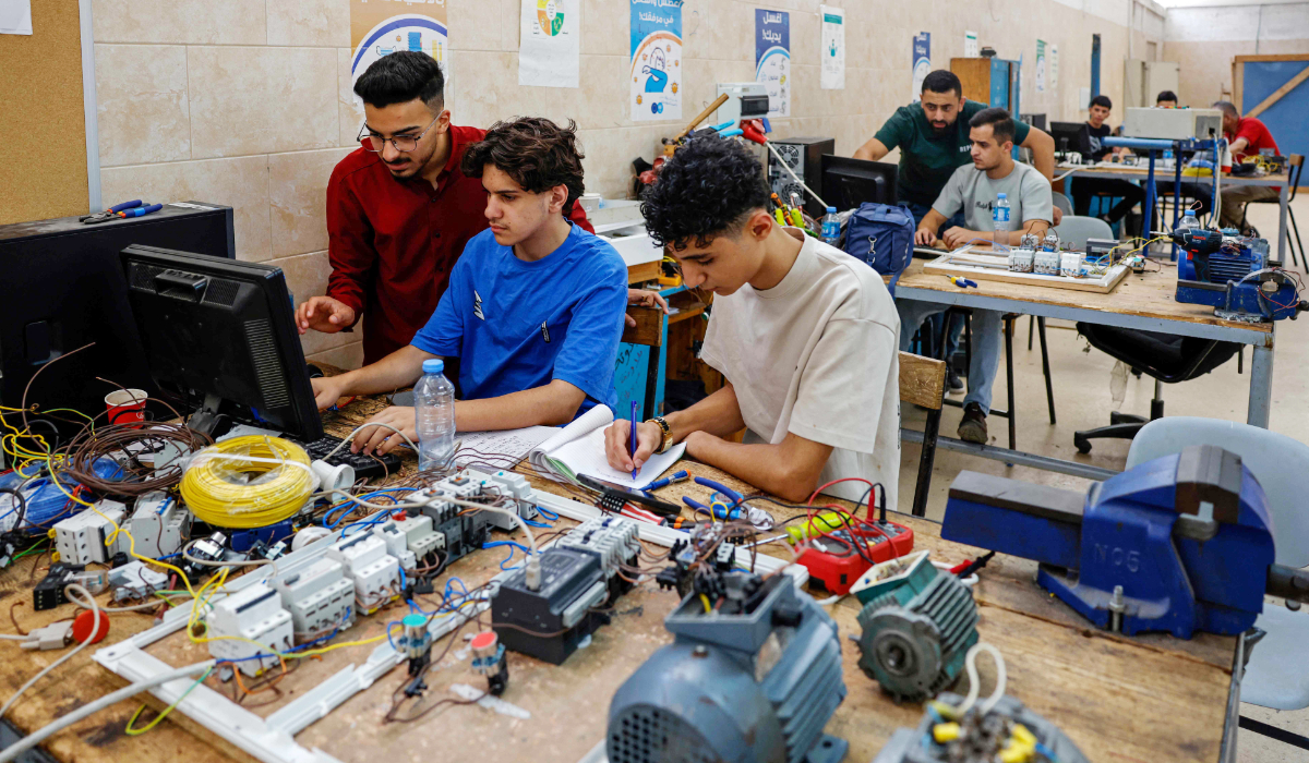 Students attend a class at the Qalandiya Vocational Training Centre run by the United Nations agency for Palestinian refugees, UNRWA, at Qalandiya in the Israeli-occupied West Bank on August 4, 2026. (AFP)