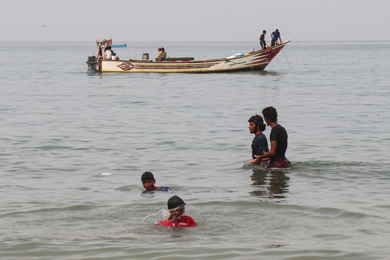 Fishermen are seen with their boats in Yemen’s western Hodeidah province, on August 2, 2026. (AFP)