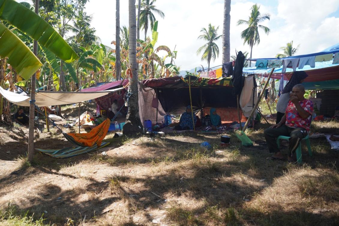 Residents stay in makeshift tents after being evacuated after the June 18, 2026 earthquake in Glan, Sarangani. (AFP file photo)