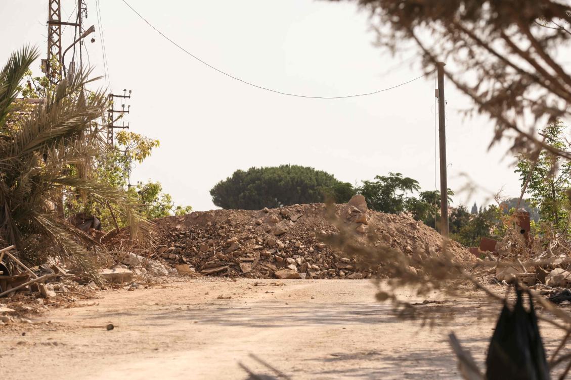 Mound of dirt put into place by the Israeli military blocks the eastern entrance of the southern Lebanese village of Zawtar al-Gharbiyah, one of the first "pilot zones" put into place following talks last month in which Israel's military withdrew from the outskirts of the village. (AFP)