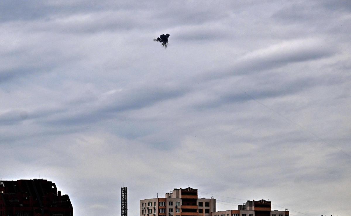 This photograph shows an explosion as Ukrainian air defence shoot down a drone above Kyiv during an attack on the Ukrainian capital on August 8, 2026 amid the Russian invasion of Ukraine. (Photo by Sergei SUPINSKY / AFP)