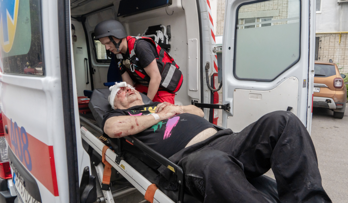 Rescuers evacuate an injured civilian after a residential building was hit following Russia's drone attack in Kharkiv, Ukraine, Sunday, Aug. 9, 2026. (AP)
