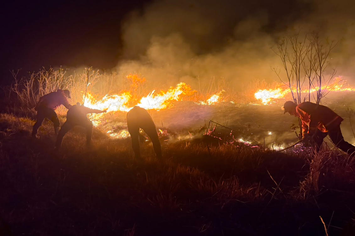 Officials say difficult terrain, strong winds and dry conditions are hampering firefighting efforts as authorities race to prevent the fires from spreading further. (AP)